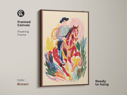 Framed canvas of a cowboy riding a horse with a brown floating frame. This western rodeo wall decor is ready to hang. The art features an expressionism print with bold colors.
