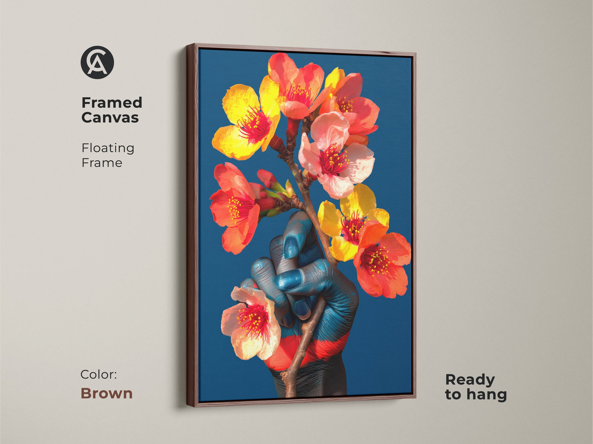 Framed canvas print featuring a blue hand holding orange and red flowers set against a blue background. This eclectic artwork is a great choice for a housewarming gift and artistic wall decor. The floating frame is brown.