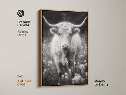 Antique gold framed canvas featuring a longhorn in a field. The black and white artwork is ready to hang. The floating frame adds a touch of elegance. This fine art photograph enhances any living space.