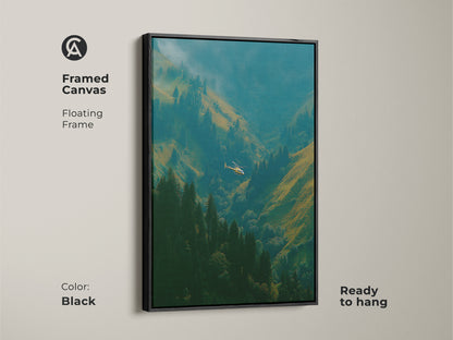 Framed canvas art featuring a helicopter flying through a green mountain valley. The floating frame is black. This framed artwork is ready to hang. Add this beautiful landscape to your home decor today.