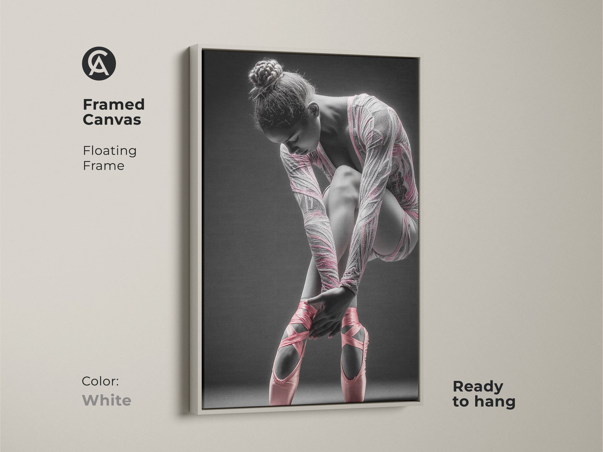 Framed canvas artwork featuring a ballerina. This canvas has a floating frame. The frame color is white. The art features a ballerina tying her pink ballet shoes. This framed art is ready to hang.