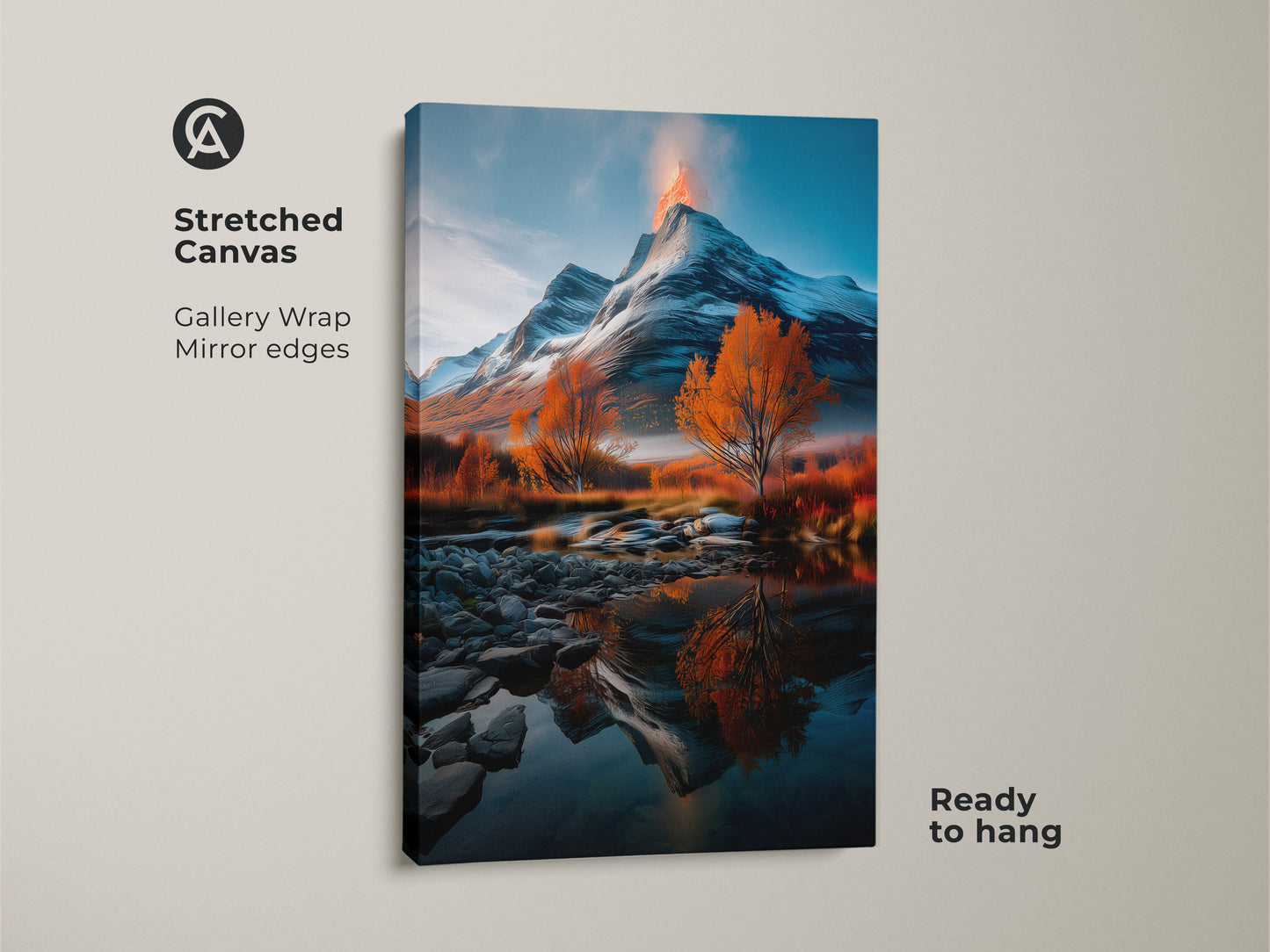 Stretched canvas print featuring a snowy volcano mountain landscape. Orange autumn trees and river reflections add beauty. This gallery wrapped canvas has mirrored edges and is ready to hang. Perfect for a rustic home decor. This nature lover gift brings the grandeur of nature to your home.