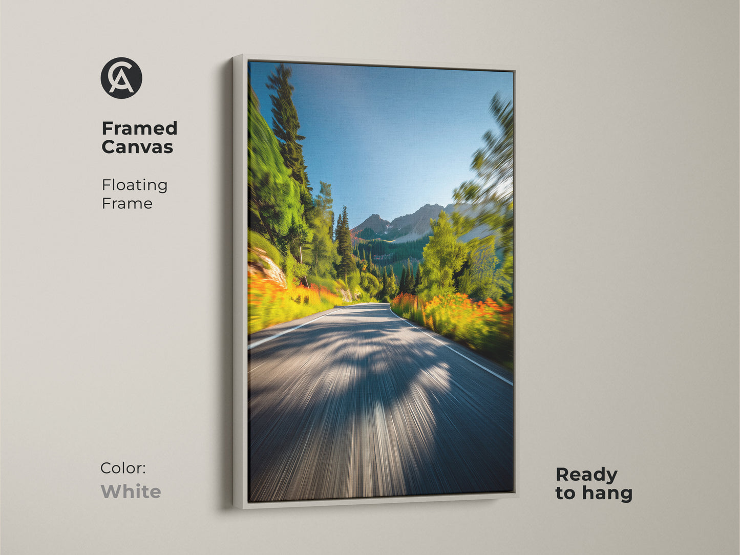 White framed canvas art displaying a mountain road. The floating frame offers a clean and modern look. This ready-to-hang artwork brings a refreshing natural scene to your decor. Ideal for contemporary spaces.