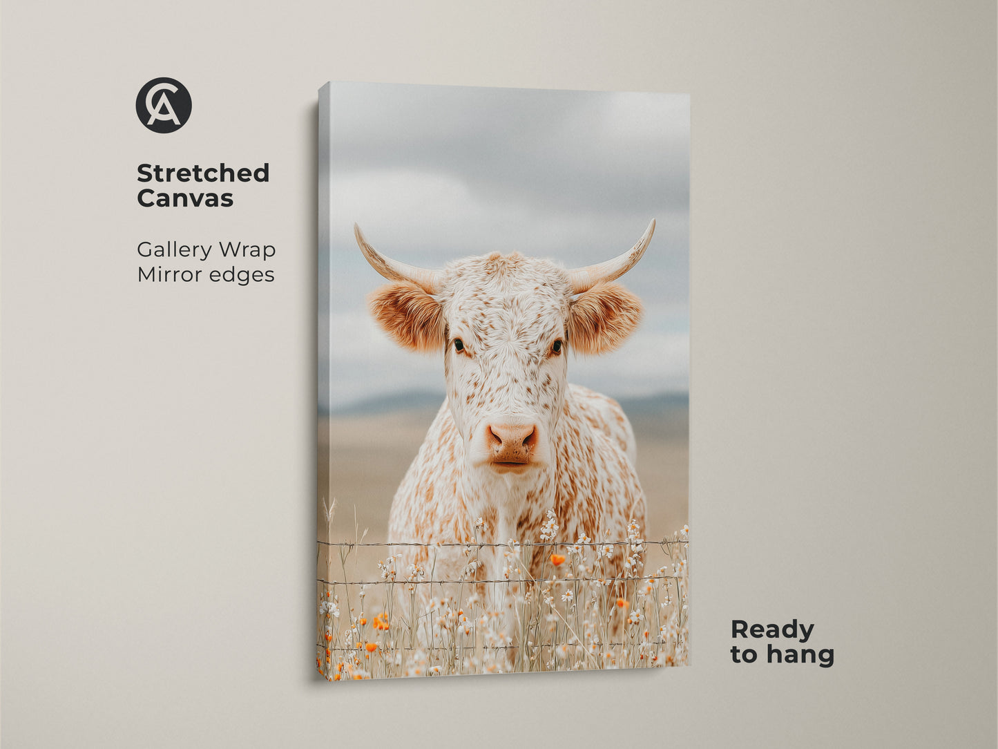 Stretched canvas art featuring a white and brown speckled longhorn cow. The canvas has gallery wrapped mirror edges. The cow stands behind a barbed wire fence. Orange wildflowers are at the base. This canvas artwork is ready to hang.
