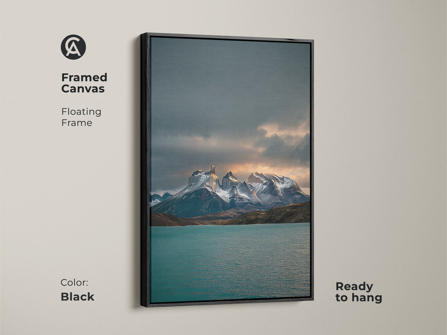 Black framed canvas featuring a teal lake and snowy peaks landscape. A serene nature wall hanging that is ready to hang. Perfect as contemporary cabin decor.