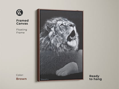 Brown framed monochrome lion canvas. This floating framed wildlife decor is ready to hang. It's suited for a contemporary bedroom or office. This powerful animal art makes a great gift.