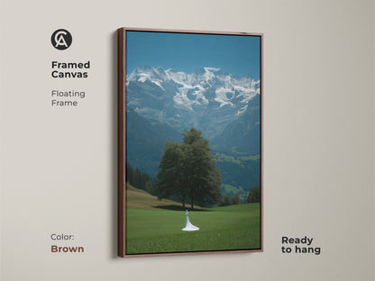 Framed canvas with a brown floating frame showing cinematic mountain artwork. Features a bride figure in a white dress. A fine art landscape canvas adds nature inspired beauty. Blue green scenic wall art perfect as a wedding gift. Contemporary home decor print ready to hang. Romantic landscape canvas artwork.