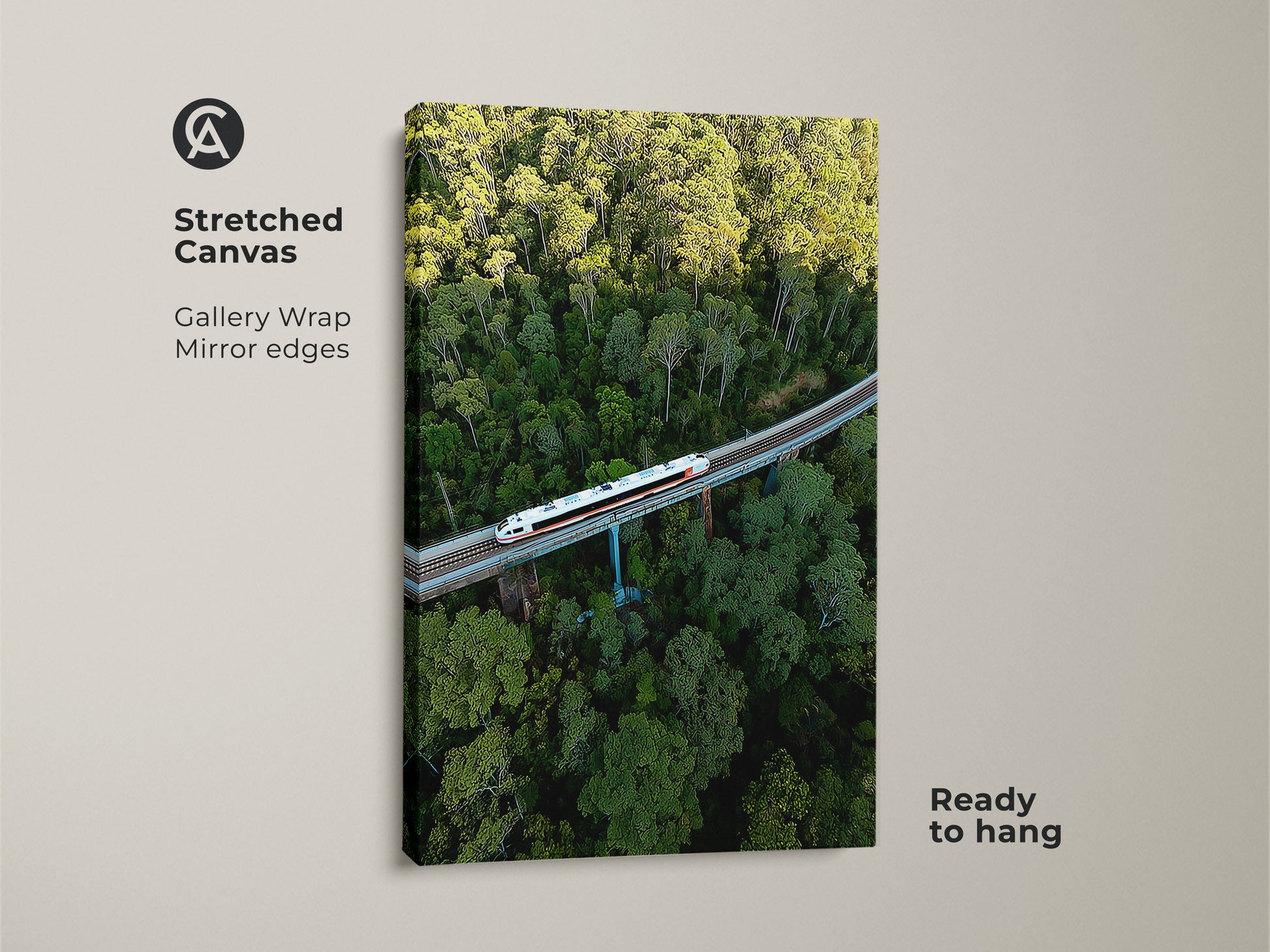 Stretched canvas art featuring an aerial train amidst a green forest. This gallery wrap canvas has mirror edges. It's a ready-to-hang modern transportation print. Perfect as forest landscape wall art. The artwork captures an overhead view. Ideal gift for travel enthusiasts.