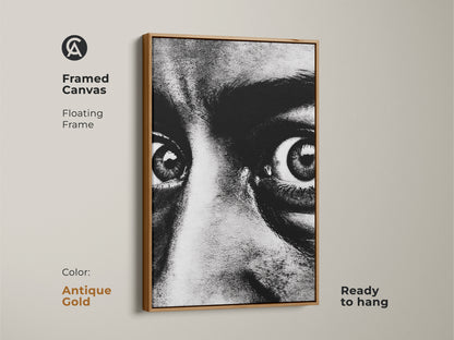 Framed canvas of a monochrome face portrait with an antique gold floating frame. Ready to hang this intense gaze canvas art adds a contemporary touch. The expressive eyes artwork is perfect for modern monochrome decor. Enhance your entryway with this bold black and white print.