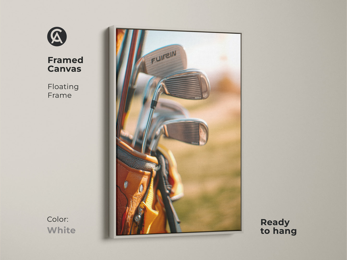 Framed canvas art of golf clubs in a tan golf bag with a floating white frame. Ready to hang. This framed golf artwork is a stylish addition to any room. Perfect for sports art collectors