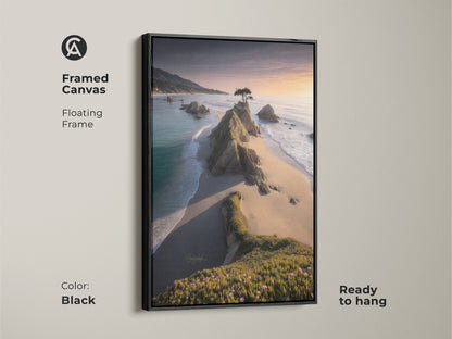 Black framed canvas featuring a coastal landscape artwork. The ocean sunset wall art showcases a lone tree on a rocky coast. This golden hour seascape print is ready to hang. Ideal for modern coastal decor and serene landscape painting.