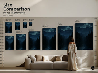 Size comparison of deep blue forest and mountain canvas prints. Inches and centimeters are shown. The rustic winter landscape wall art fits above a sofa. Teal nature artwork complements any room.