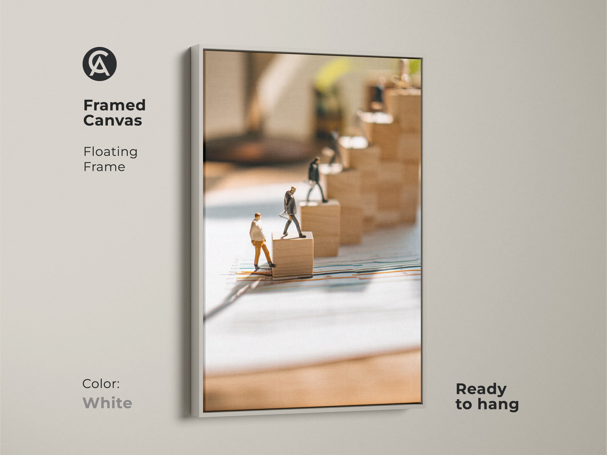 Framed canvas artwork with miniature figures climbing wooden blocks. This office wall art has a floating frame in white and is ready to hang. It serves as conceptual business print that shows progress and achievement. Perfect motivational decor.