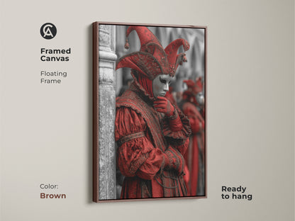 Framed canvas art of a Venetian Carnival jester. Red mask masquerade artwork for a unique room aesthetic. Gothic Baroque costume art on the walls. Eclectic Italian festival decor framed in brown. Crimson Jester Mask art ready for display.