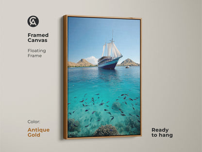 Coastal wall decor with framed canvas artwork. The floating frame beautifully presents a sailing ship art. This artwork features serene turquoise waters. See a school of fish below. Enhance your living room ocean artwork. Ready to hang with antique gold finish frame.