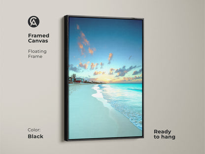 Framed canvas features a floating frame around tropical artwork. Black frame complements the sky blue and golden yellow sunset. Ready to hang as bedroom wall decor beach style.