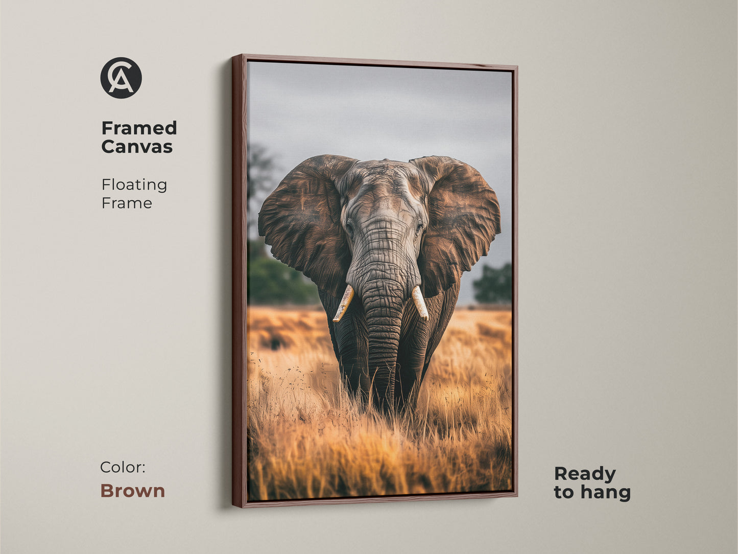 Framed canvas of an elephant portrait in brown. This wildlife wall art features a floating frame. The earthy brown and grey tones bring a rustic touch to your living room or bedroom. This ready to hang canvas is a perfect housewarming gift. The photorealistic animal is showcased in its natural habitat.