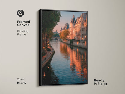 Framed canvas art featuring a Parisian cityscape. The black floating frame enhances the Seine River photography. Golden hour adds warmth to the Parisian buildings. This ready-to-hang piece offers contemporary home decor. Bring the romance of France into your space. This is a stylish piece for living rooms.