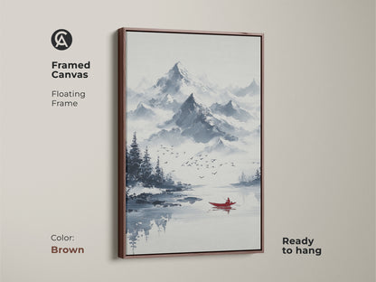 Framed canvas of ink wash mountain art. This minimalist boat canvas print features a floating brown frame. Ready to hang this blue gray landscape art enhances a living room. The serene lake artwork is ideal for minimalist homes.