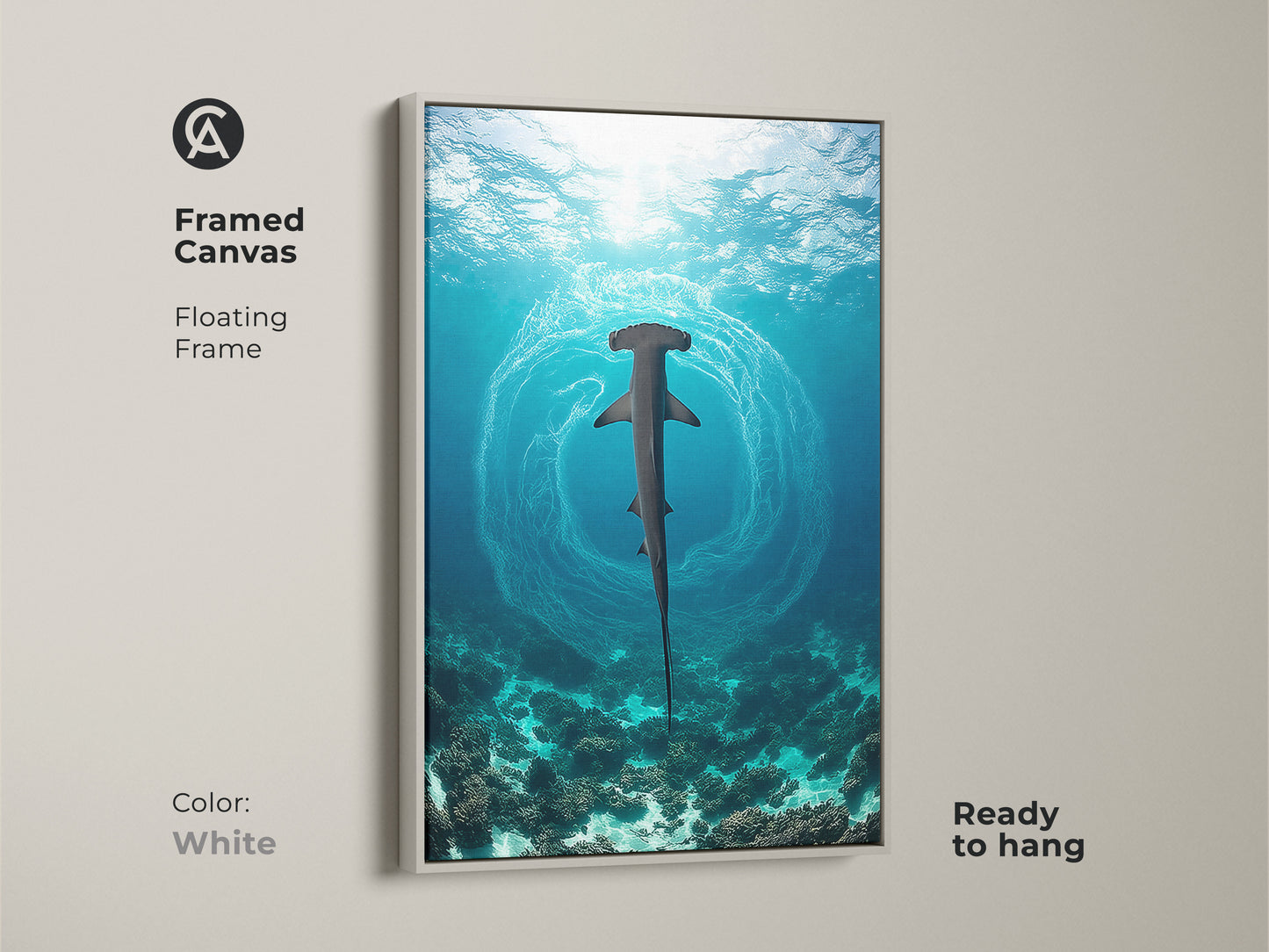 A framed canvas art piece captures a hammerhead shark swimming above a coral reef. The white floating frame enhances the deep blue ocean scene. Ready to hang this marine life art brings the beauty of the sea into your home. It is a perfect gift for coastal living decor.