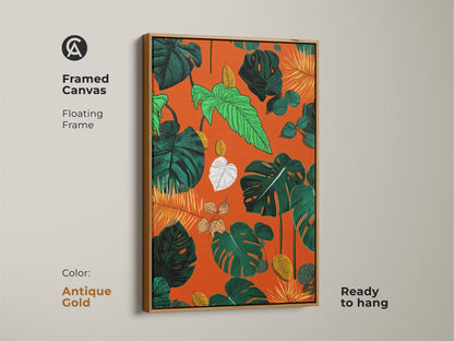Framed canvas with a floating frame displays boho botanical artwork. Antique gold frame enhances the tropical Monstera and fern leaves. The vibrant orange green and yellow colors bring life to any room. Ready to hang this leafy jungle artwork is perfect as a unique housewarming gift.