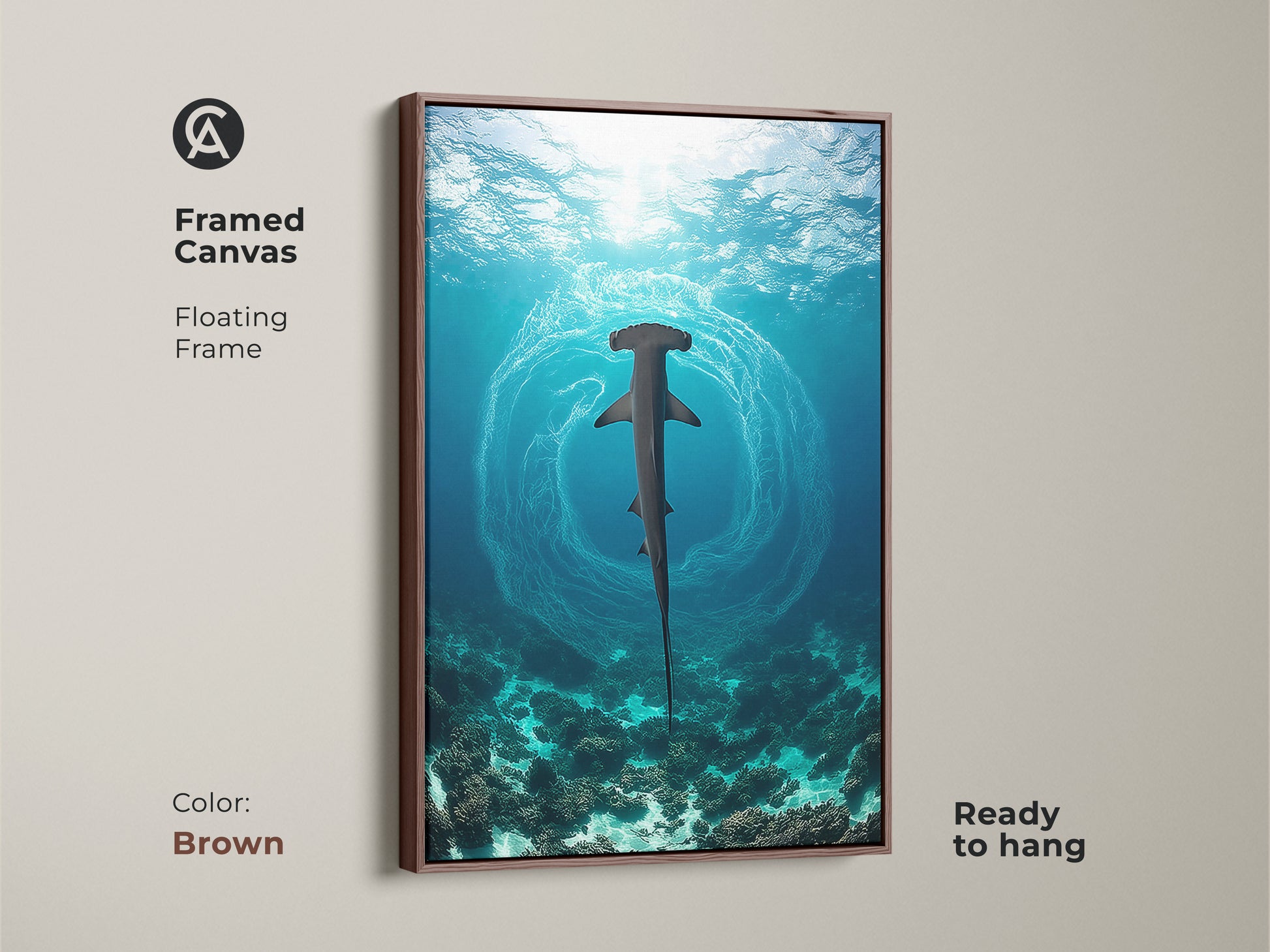 This framed canvas artwork shows a hammerhead shark in a deep blue coral reef setting. The brown floating frame complements the marine life scene. This piece is ready to hang and adds a touch of nautical charm to any room. It's an ideal gift for ocean lovers and housewarming occasions.