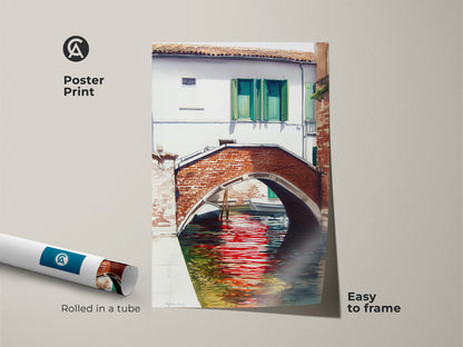 This poster print shows a watercolor painting of a Venice canal with a brick bridge. The red reflections art is easy to frame. It is rolled in a tube for protection. Ideal wall art for travel enthusiasts.