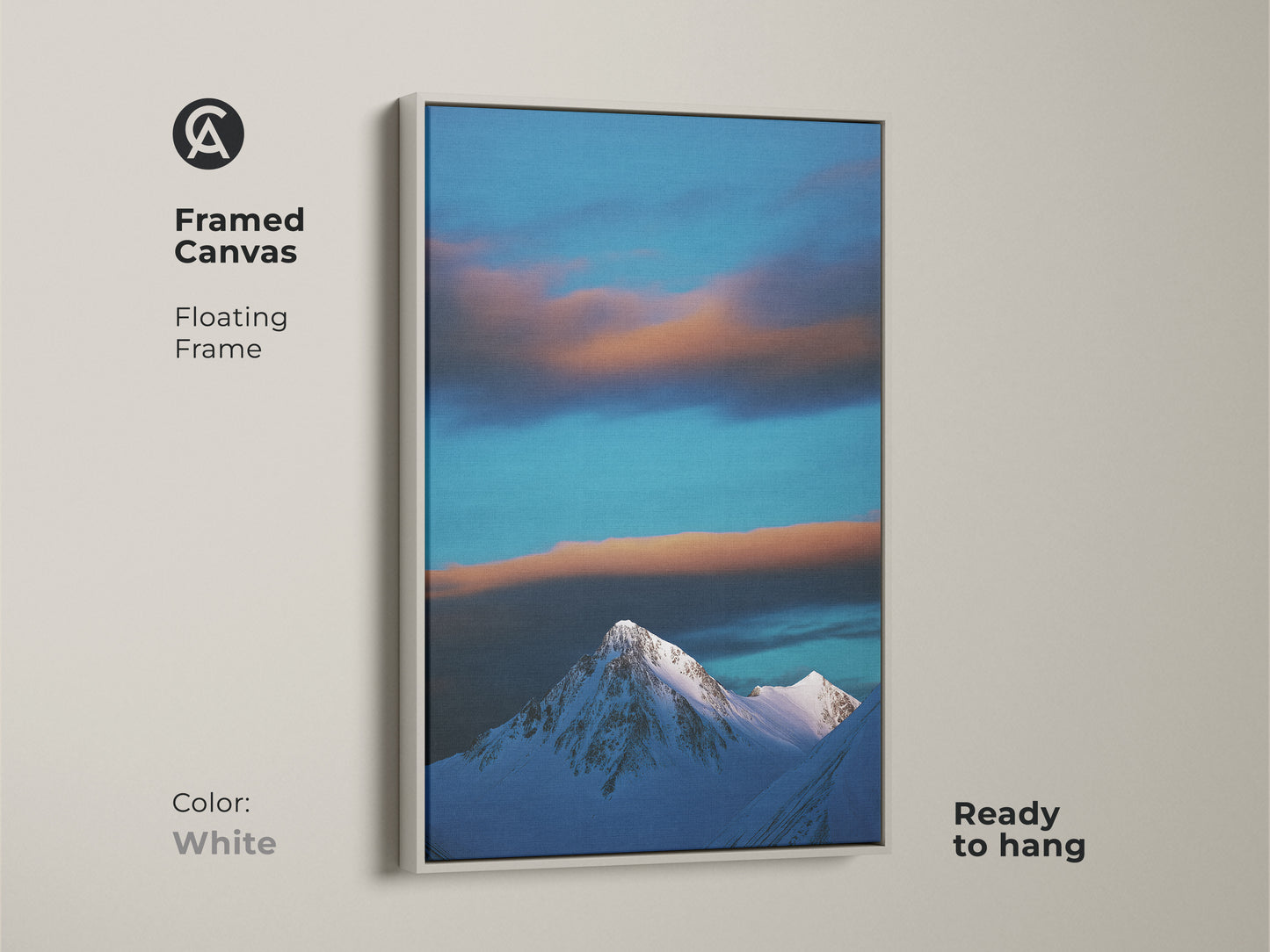 A white framed canvas features a snowy mountain landscape under a blue sky. This contemporary nature artwork is ready to hang. It brings a minimalist mountain art vibe to any room. Perfect for adding a tranquil touch.
