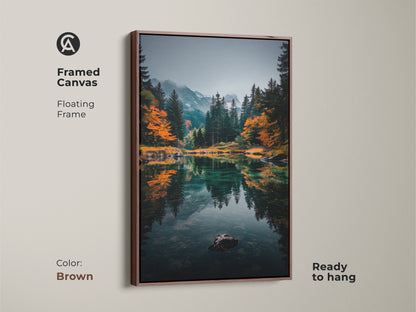 Enhance your home decor with this framed mountain lake canvas. The floating frame in brown adds warmth to the serene scene. The artwork captures a tranquil lake reflecting the surrounding mountains and trees. Ready to hang and admire. Bring nature indoors today