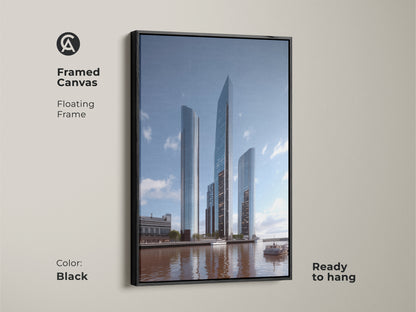 Black framed canvas art with a floating frame enhances a modern cityscape. The steel blue and gray tones reflect in the river. This building artwork on canvas is ready to hang adding urban sophistication to any contemporary art collection.