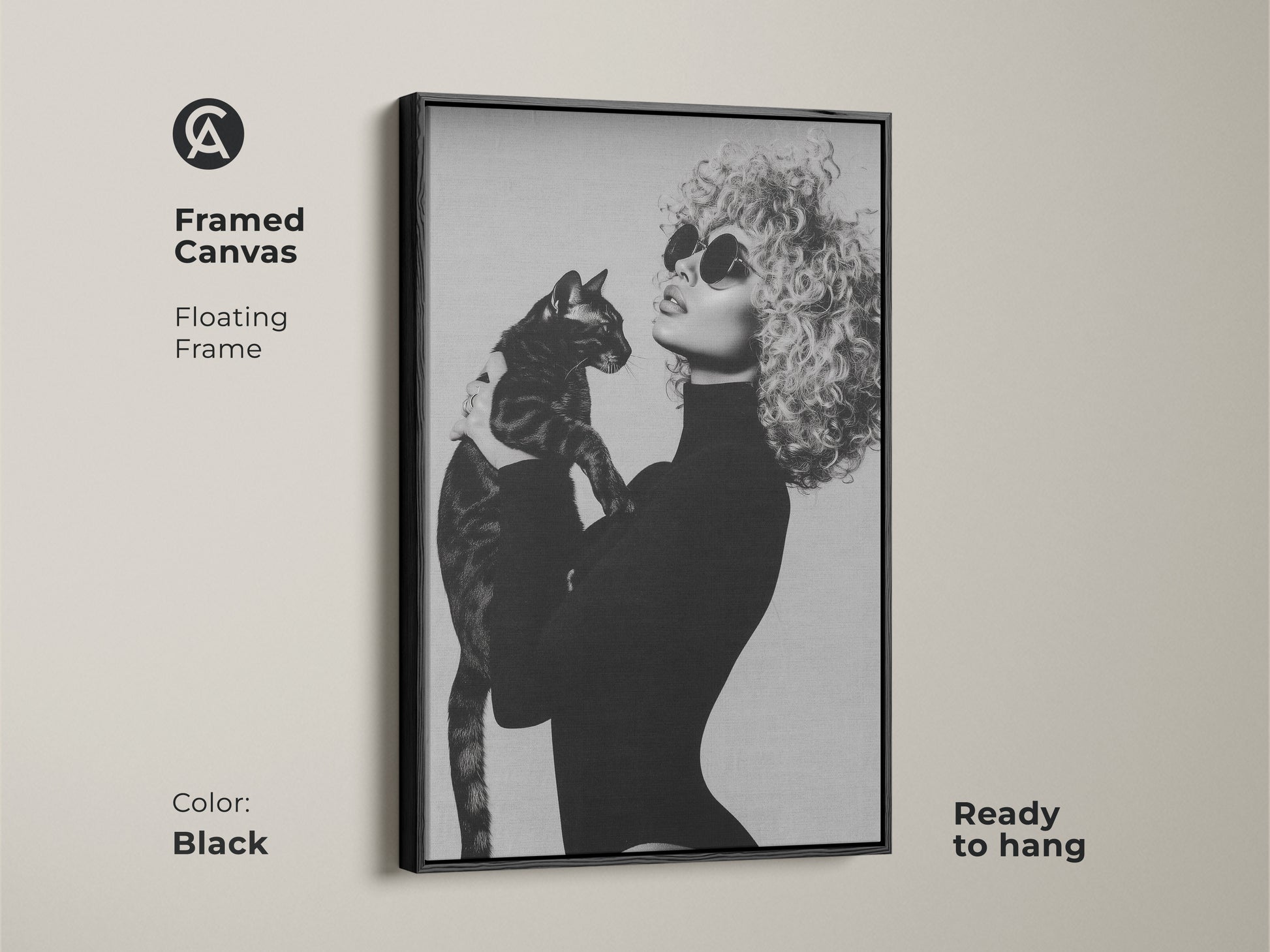 Framed canvas print showcasing a monochrome artwork of a fashionable woman with a cat. This black and white wall decor offers a contemporary glamour to any room. The floating frame adds elegance and this ready-to-hang art is a perfect chic gift for cat moms.