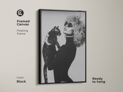 Framed canvas print showcasing a monochrome artwork of a fashionable woman with a cat. This black and white wall decor offers a contemporary glamour to any room. The floating frame adds elegance and this ready-to-hang art is a perfect chic gift for cat moms.