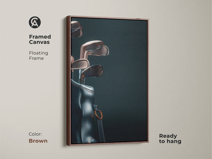 Enhance your decor with framed canvas art. This floating frame highlights a stylish golf bag and clubs. The brown frame adds a warm touch. Ready to hang this piece will impress any golf aficionado.