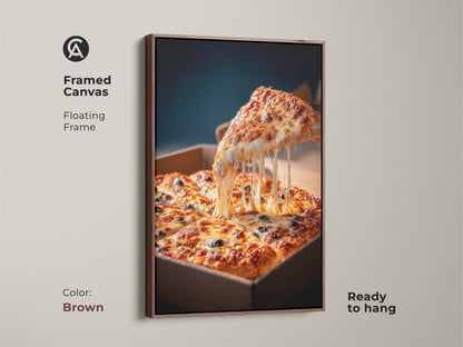 Brown framed canvas pizza art. The artwork has a floating frame. A slice of pizza is lifted with melted cheese. A square pizza in a cardboard box is below. This pizza artwork is ready to hang.