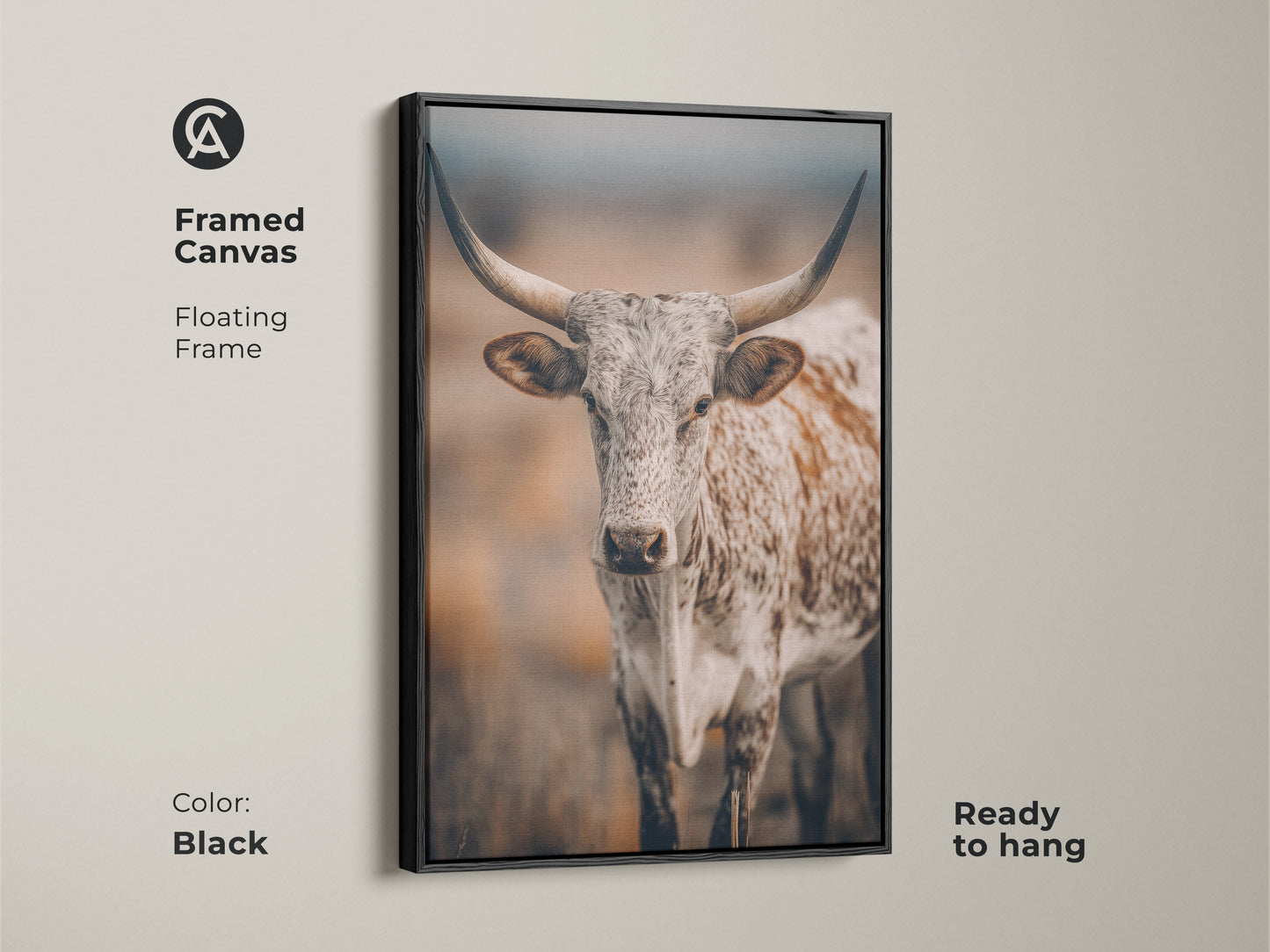 Framed canvas featuring Longhorn Cow artwork. The floating frame adds a modern touch to the rustic Texas wildlife. The canvas is black in color and ready to hang. It is ideal for farmhouse decor. This print enhances any living space with its country charm.