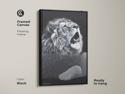 Black framed monochrome lion canvas. This floating framed wildlife decor is ready to hang. It's suited for a contemporary bedroom or office. The powerful animal art is perfect for a gallery wall.