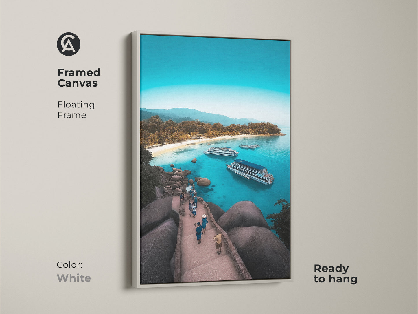 Framed canvas displaying an aerial island beach. White floating frame enhances the turquoise ocean view art. This coastal landscape wall art is ready to hang. The boat filled bay print captures a tropical island getaway. It's a blue water seascape with a summer vacation vibe. Ideal for beach house decor.