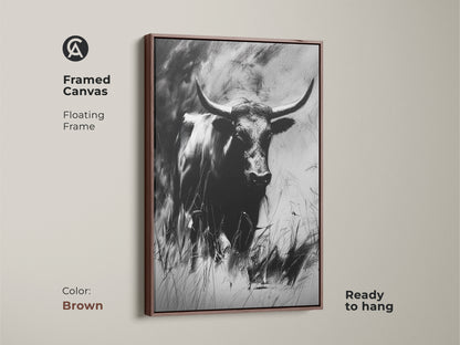 A framed canvas print shows a monochrome bull artwork. The floating frame has a brown finish. This charcoal sketch longhorn is ready to hang. Ideal for rustic farmhouse decor and wildlife art lovers.