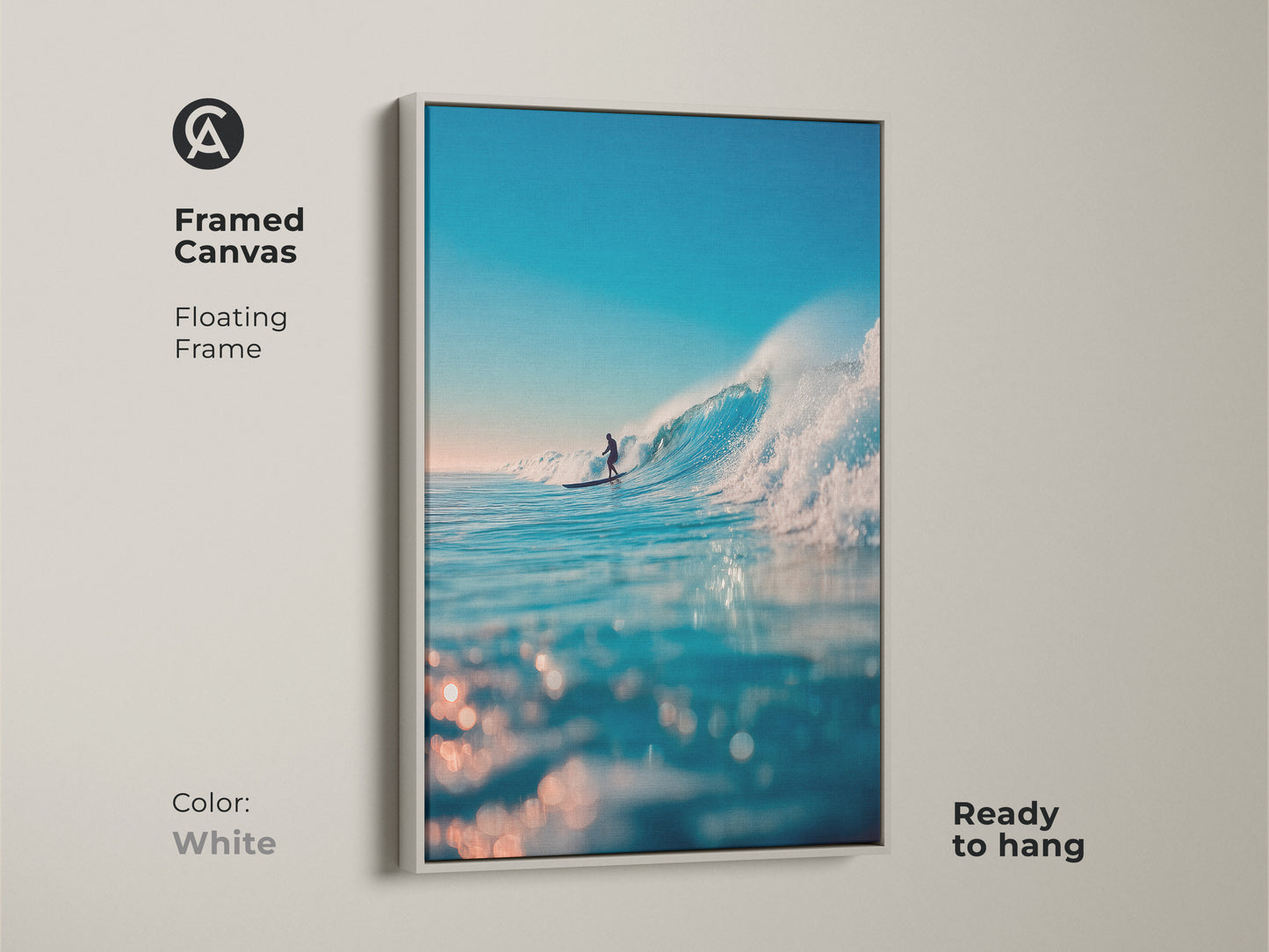 A framed canvas showcases a surfer riding a wave. The floating frame is white and the artwork is ready to hang. The clean look complements any space. This ocean artwork is perfect for modern homes get yours today.
