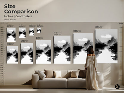 Size comparison of the black white ink wash art print in inches and centimeters. See how the mountain river landscape canvas fits above a sofa. This minimalist nature wall art is perfect for creating a Japandi bedroom decor. The Japanese Sumi-e style artwork enhances your living space with its serene beauty.