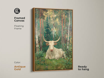 A framed canvas print presents a white longhorn bull resting in a forest. The antique gold floating frame enhances the vintage feel of this artwork. This piece is ready to hang adding a touch of elegance.