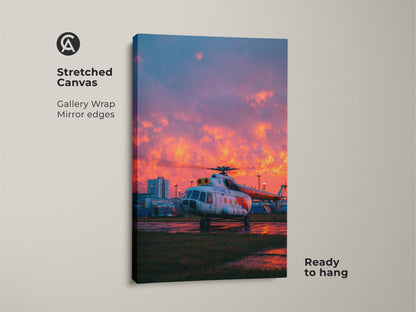 Stretched canvas showcasing aviation art. A detailed helicopter is set against a vibrant sunset sky. The gallery wrap and mirror edges give a modern look. It comes ready to hang aviation art.