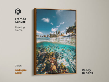 Antique gold framed canvas art of a split view ocean scene. A tropical beach meets a coral reef with a school of fish. Stunning coastal art ready to hang.