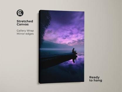 Surreal lake canvas art in a gallery wrap. It shows a person on a dock beneath a purple night sky. A dreamy landscape poster perfect for minimalist bedroom decor. This violet starry night print is ready to hang.