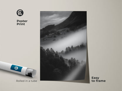 Poster print of a foggy mountain village. This black and white landscape is rolled in a tube for easy framing. The monochrome mountain art offers contemporary wall decor. A minimalist home art showcasing a misty forest scene.