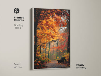 Framed canvas print of a forest in autumn. A white floating frame enhances the artwork. The colorful fall scene creates a peaceful mood. It is ready to hang and admire.