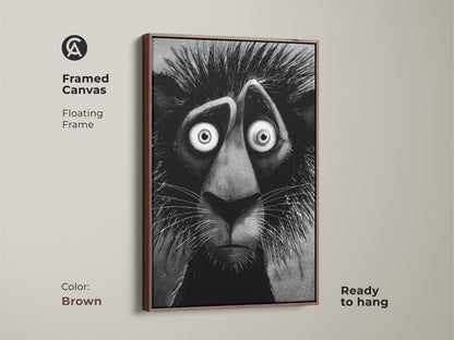 Brown framed canvas of a lion artwork ready to hang. This floating frame artwork features a stylized lion with an anxious expression. It will add character and charm to any room. This artwork is gallery ready.