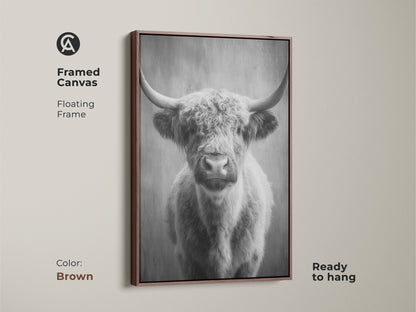 Brown framed canvas showcasing a monochrome highland cow. The floating frame adds elegance to the farm animal wall decor. This Scottish cattle canvas art is ready to hang and enhances living room canvas art. A rustic animal artwork.