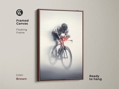 Framed canvas of a cyclist in action. This floating frame is in brown. The monochrome racing art comes ready to hang. This sports speed wall art is a dynamic decor. The artwork is a great piece for any space.