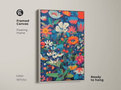 Framed canvas of botanical abstract wall art. The floating frame is white. This floral print features deep blue coral red and teal colors. The modern folk art decor is ready to hang.